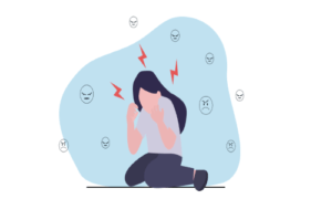 Person sitting with angry expressions around them.