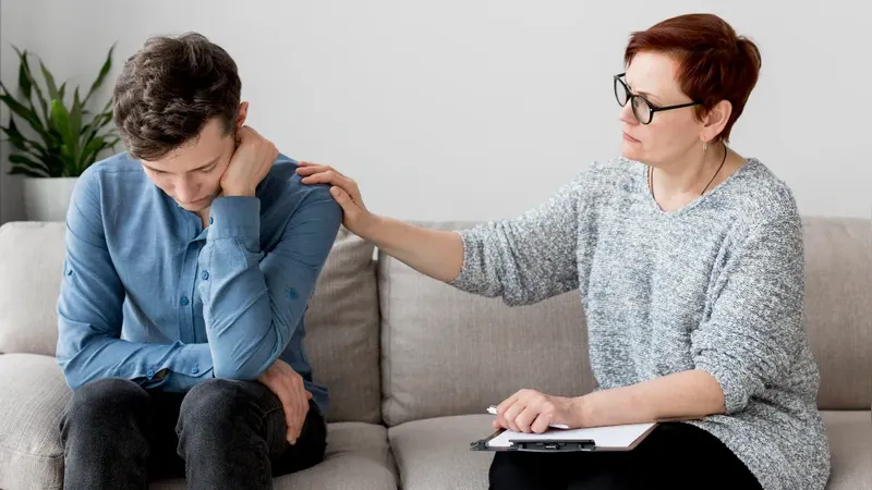 EMDR therapy a therapist gently tapping patient during phase