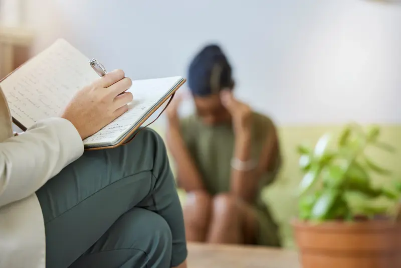Therapy writing psychologist sad black woman with stress headache